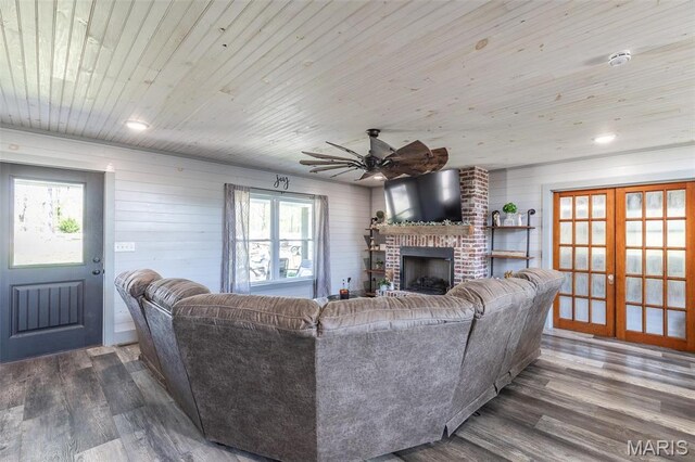 176 Carter 205, Van Buren, MO 63965 - living room with ceiling fan, healthy amount of natural light, dark wood-style floors, wooden ceiling, and wooden walls