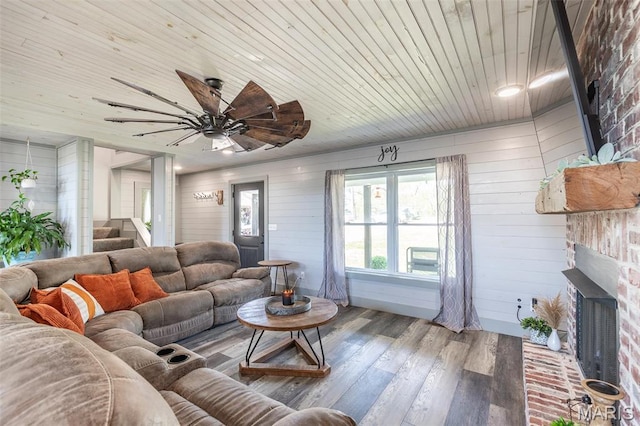 176 Carter 205, Van Buren, MO 63965 - living room with wood finished floors, wooden walls, a fireplace, wooden ceiling, and stairway