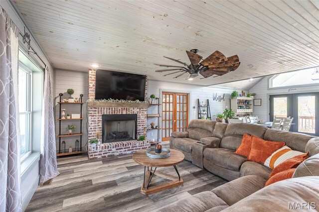 176 Carter 205, Van Buren, MO 63965 - living area featuring french doors, wood finished floors, wood ceiling, a ceiling fan, and a brick fireplace