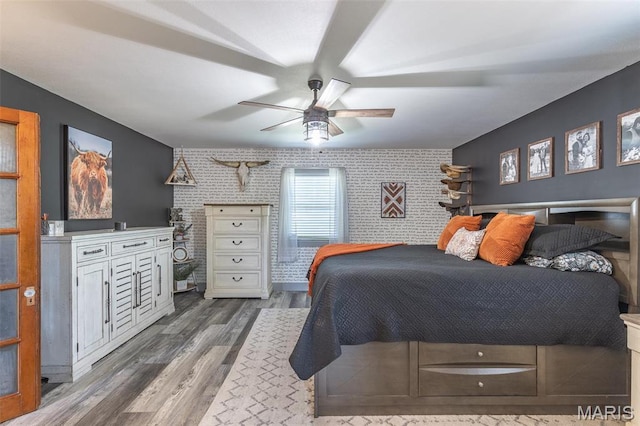 176 Carter 205, Van Buren, MO 63965 - bedroom featuring an accent wall, wood finished floors, and ceiling fan