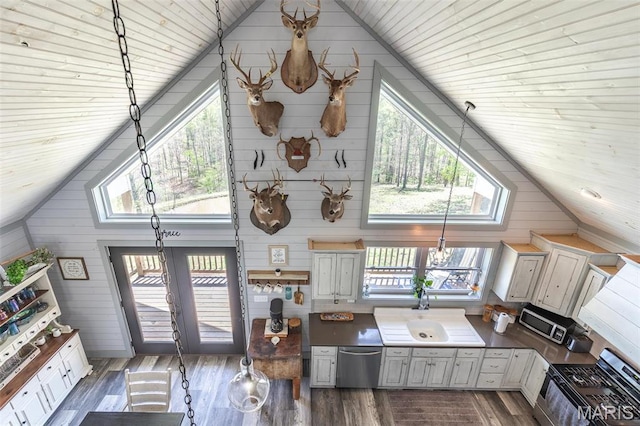 176 Carter 205, Van Buren, MO 63965 - living room featuring plenty of natural light, wood walls, wood finished floors, high vaulted ceiling, and wood ceiling