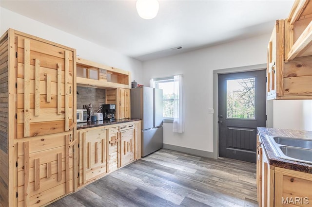 176 Carter 205, Van Buren, MO 63965 - kitchen with freestanding refrigerator, wood finished floors, baseboards, dark countertops, and white microwave