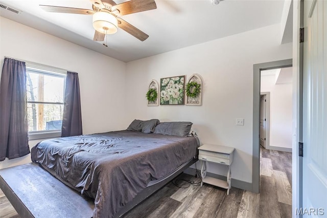 176 Carter 205, Van Buren, MO 63965 - bedroom featuring wood finished floors, ceiling fan, and baseboards