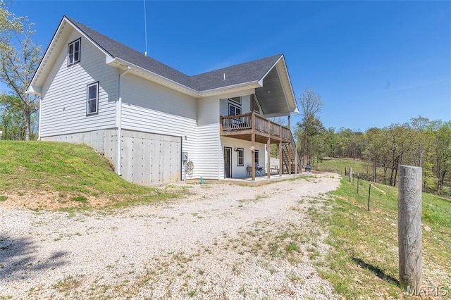 176 Carter 205, Van Buren, MO 63965 - view of property exterior with a deck, a patio area, stairway, and roof with shingles