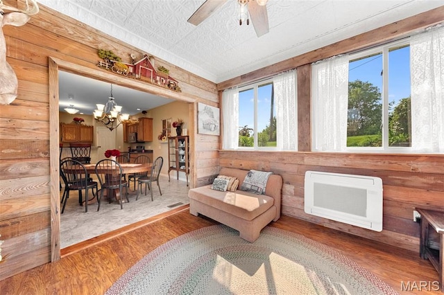 235 River Bluff Ct, Troy, MO 63379 - living area featuring wood finished floors, a chandelier, and ceiling fan