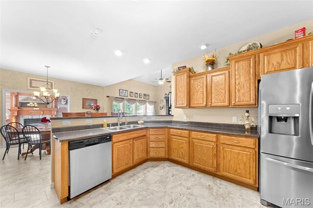235 River Bluff Ct, Troy, MO 63379 - kitchen featuring stainless steel appliances, a sink, a chandelier, a peninsula, and dark countertops