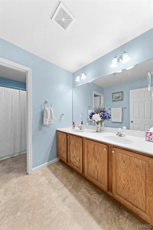 235 River Bluff Ct, Troy, MO 63379 - bathroom with double vanity and baseboards