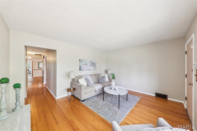 4116 Parker Ave, Saint Louis, MO 63116 - living room with light wood finished floors and baseboards