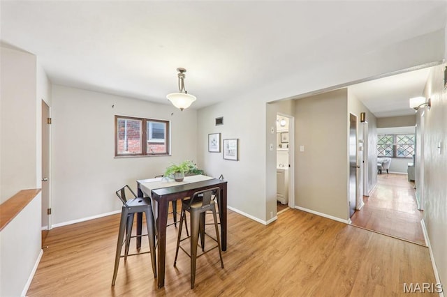 4116 Parker Ave, Saint Louis, MO 63116 - dining room featuring light wood-style floors and baseboards