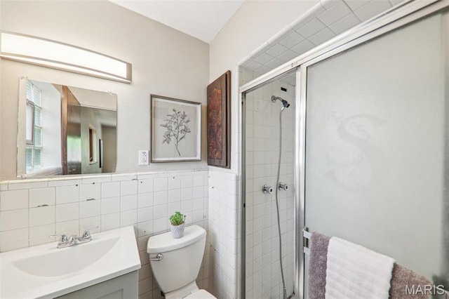 4116 Parker Ave, Saint Louis, MO 63116 - bathroom featuring a stall shower, toilet, vanity, and tile walls