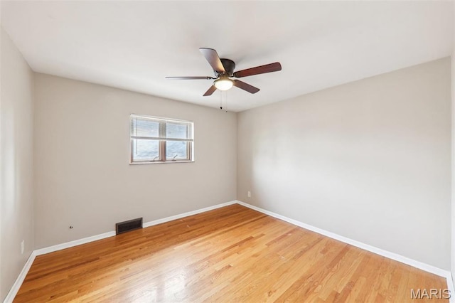 4116 Parker Ave, Saint Louis, MO 63116 - spare room with baseboards, light wood-type flooring, and ceiling fan