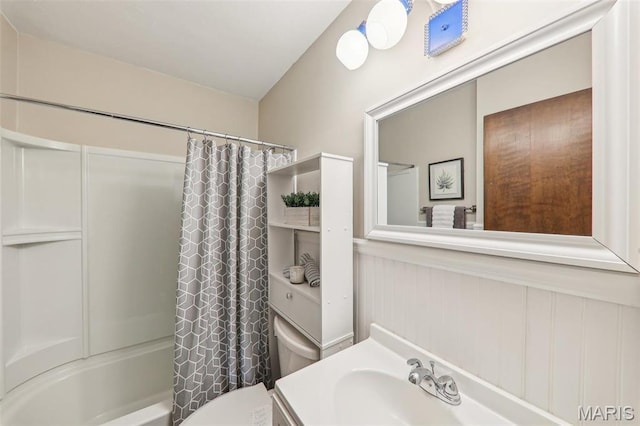 4116 Parker Ave, Saint Louis, MO 63116 - full bath featuring toilet, shower / bathtub combination with curtain, vanity, and a wainscoted wall