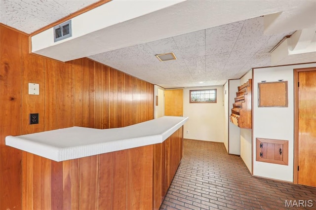 4116 Parker Ave, Saint Louis, MO 63116 - hallway with brick flooring and wooden walls