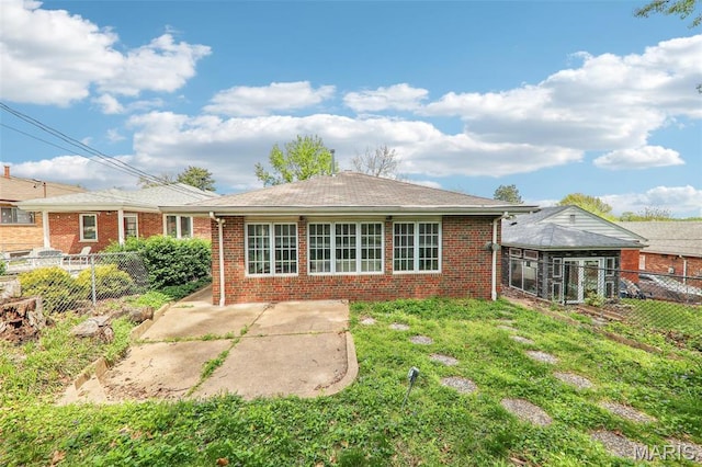 4116 Parker Ave, Saint Louis, MO 63116 - back of house featuring a patio area, brick siding, and a fenced backyard