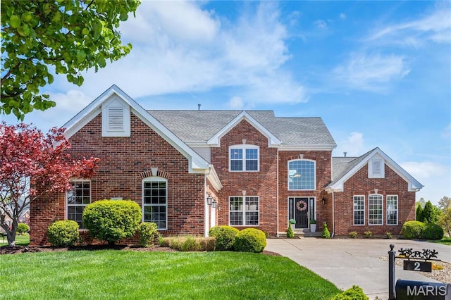 2 Pearview Ct, Saint Peters, MO 63376 - traditional-style home featuring brick siding, a front yard, and a shingled roof