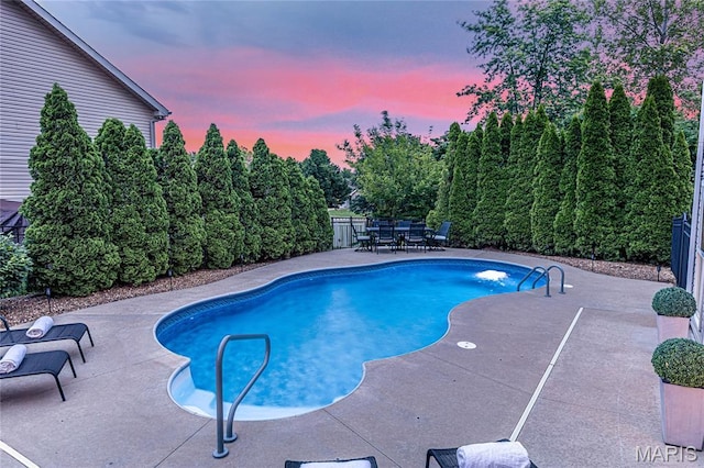 2 Pearview Ct, Saint Peters, MO 63376 - pool at dusk featuring a patio area and outdoor dining space