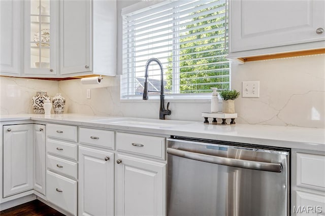 2 Pearview Ct, Saint Peters, MO 63376 - kitchen featuring dishwasher, a sink, glass insert cabinets, tasteful backsplash, and white cabinetry
