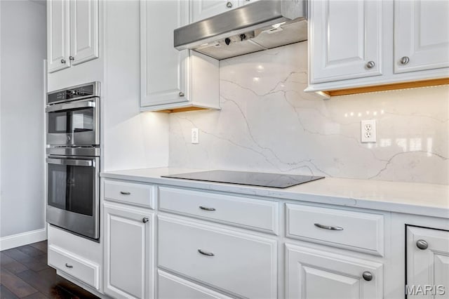 2 Pearview Ct, Saint Peters, MO 63376 - kitchen featuring under cabinet range hood, black electric cooktop, stainless steel double oven, and tasteful backsplash