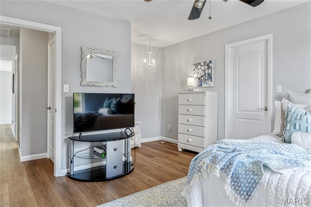 2 Pearview Ct, Saint Peters, MO 63376 - bedroom featuring wood finished floors, baseboards, a chandelier, and ceiling fan