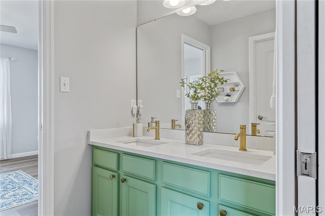 2 Pearview Ct, Saint Peters, MO 63376 - full bathroom with double vanity, wood finished floors, and baseboards