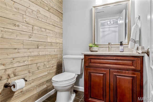 2 Pearview Ct, Saint Peters, MO 63376 - bathroom with wooden walls, toilet, vanity, tile patterned flooring, and baseboards