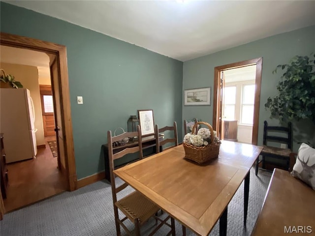 104 E 12th St, Hermann, MO 65041 - dining room with carpet flooring and baseboards
