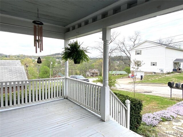 104 E 12th St, Hermann, MO 65041 - wooden deck featuring covered porch