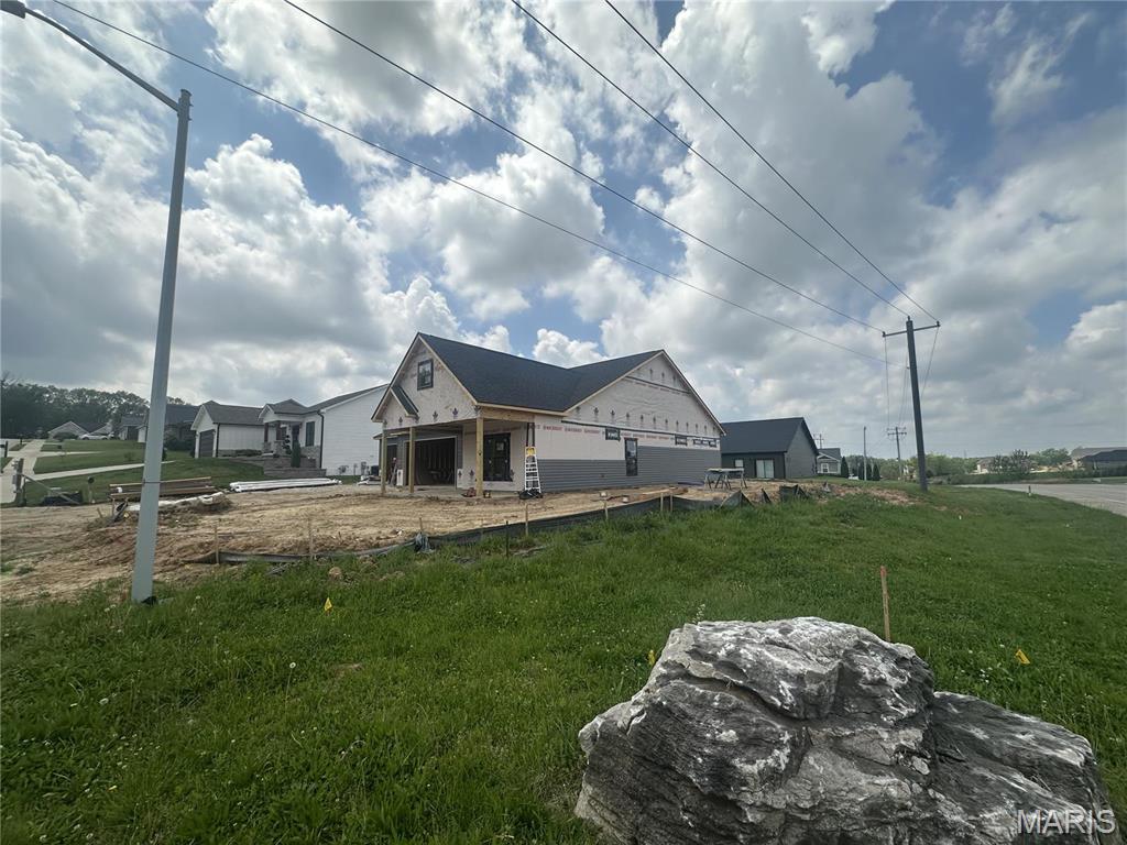 view of property exterior featuring a yard