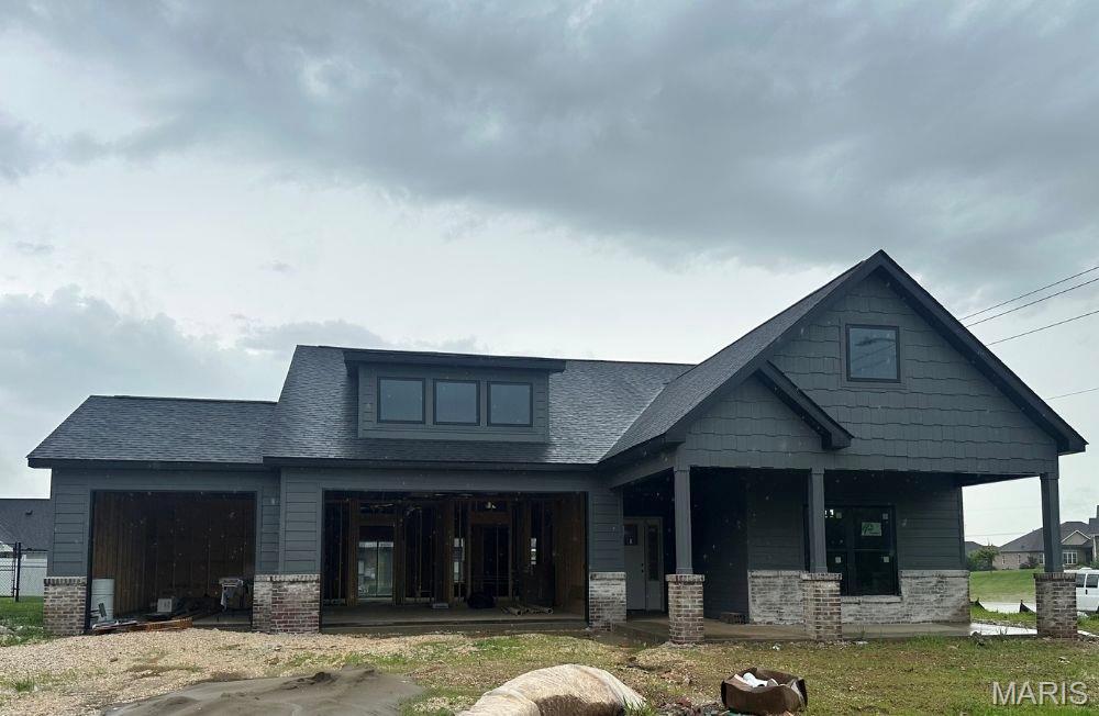3641 Tower Rdg, Cape Girardeau, MO 63701 - view of front of property featuring covered porch, brick siding, and a shingled roof