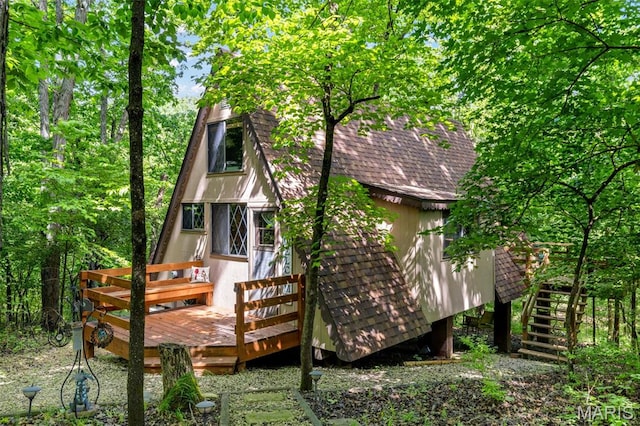 424 Scheffborg Circle Dr, Innsbrook, MO 63390 - view of side of home with stairway, roof with shingles, and a wooden deck