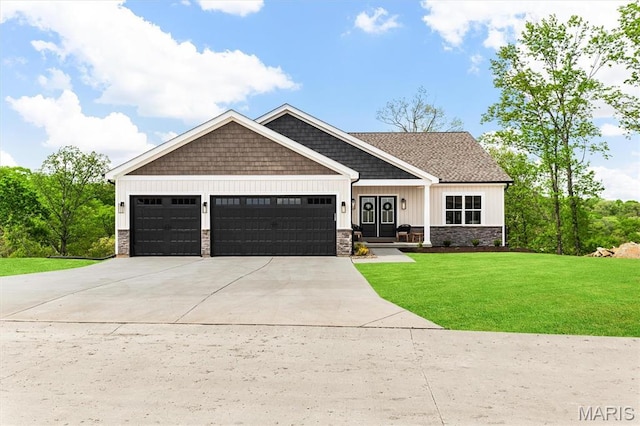 2217 Valleyview Dr, Barnhart, MO 63012 - craftsman house with an attached garage, a front lawn, concrete driveway, stone siding, and board and batten siding