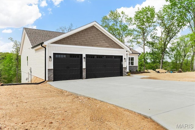 2217 Valleyview Dr, Barnhart, MO 63012 - view of property exterior with a garage, concrete driveway, and stone siding