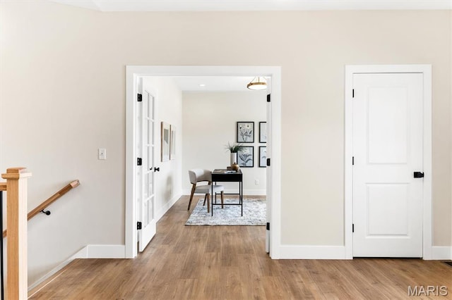 2217 Valleyview Dr, Barnhart, MO 63012 - hallway with an upstairs landing, light wood-type flooring, and baseboards