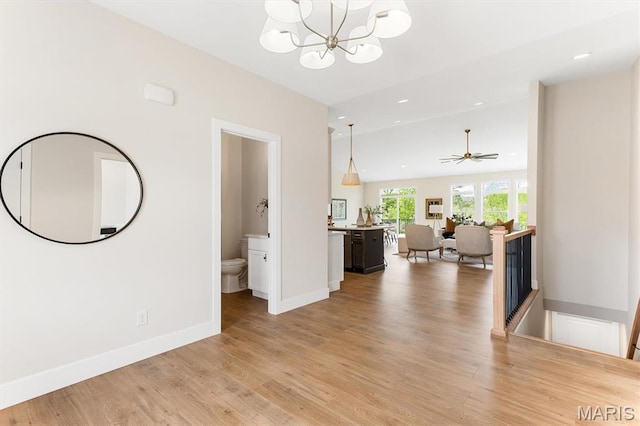 2217 Valleyview Dr, Barnhart, MO 63012 - corridor with light wood-style floors, a chandelier, baseboards, recessed lighting, and an upstairs landing