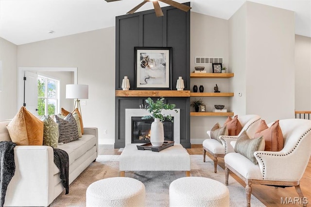 2217 Valleyview Dr, Barnhart, MO 63012 - living area with lofted ceiling, light wood-style floors, a ceiling fan, and a large fireplace