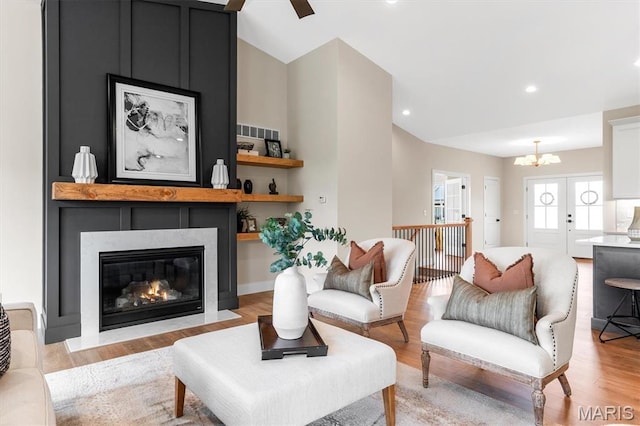 2217 Valleyview Dr, Barnhart, MO 63012 - living room featuring a chandelier, light wood finished floors, a fireplace, and recessed lighting