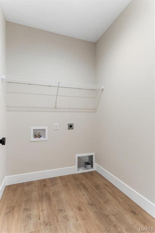 2217 Valleyview Dr, Barnhart, MO 63012 - laundry area featuring electric dryer hookup, light wood finished floors, washer hookup, and baseboards