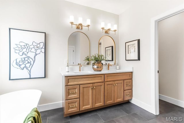 2217 Valleyview Dr, Barnhart, MO 63012 - bathroom featuring double vanity, baseboards, a soaking tub, and tile patterned floors