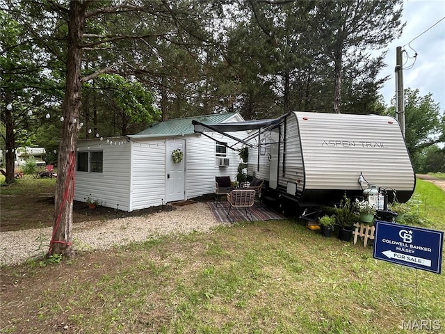 6423 Cedar Lake Dr, Bonne Terre, MO 63628 - back of house featuring a lawn and view of scattered trees