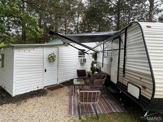 6423 Cedar Lake Dr, Bonne Terre, MO 63628 - view of patio / terrace with cooling unit and an outdoor structure
