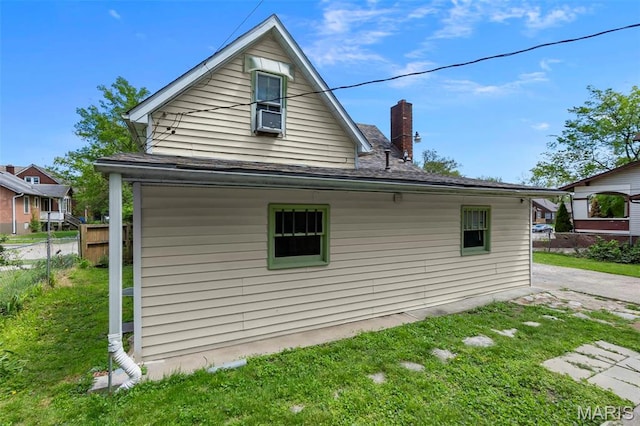 63 N Hanover St, Cape Girardeau, MO 63701 - view of side of home featuring a chimney