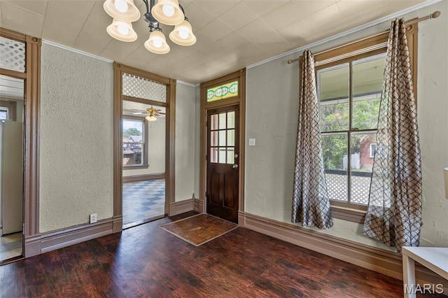 63 N Hanover St, Cape Girardeau, MO 63701 - entrance foyer featuring a textured wall, a chandelier, ornamental molding, dark wood-style flooring, and baseboards