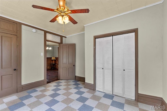 63 N Hanover St, Cape Girardeau, MO 63701 - unfurnished bedroom featuring baseboards, crown molding, a closet, a ceiling fan, and light floors