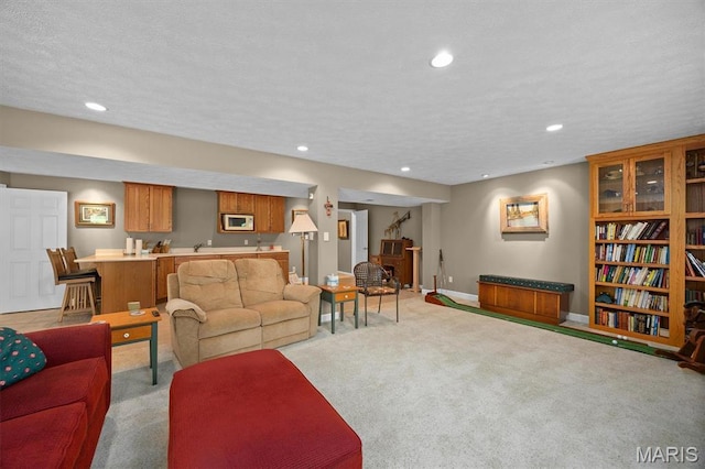 1674 Lakepointe Estates Dr, Ofallon, IL 62269 - living area featuring light carpet, recessed lighting, wet bar, and a textured ceiling