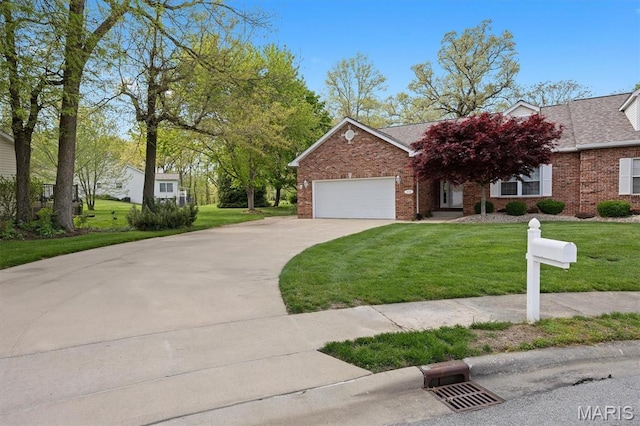 1674 Lakepointe Estates Dr, Ofallon, IL 62269 - view of front of property with driveway, a garage, brick siding, and a front lawn