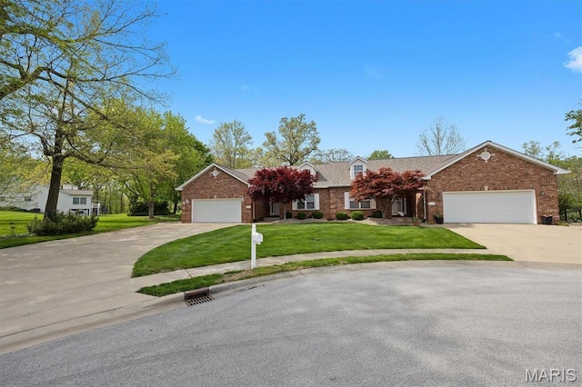 1674 Lakepointe Estates Dr, Ofallon, IL 62269 - view of front facade featuring brick siding, a front yard, driveway, and an attached garage