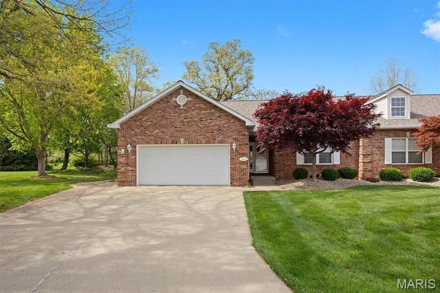 1674 Lakepointe Estates Dr, Ofallon, IL 62269 - view of front facade with driveway, a garage, a front yard, and brick siding