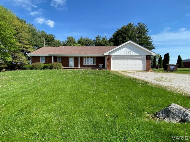 25127 N 16th Ave, Nokomis, IL 62075 - ranch-style house featuring a garage, driveway, a front lawn, and brick siding