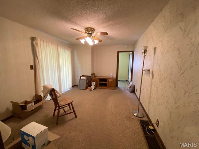 25127 N 16th Ave, Nokomis, IL 62075 - miscellaneous room with a ceiling fan, a textured ceiling, wallpapered walls, and carpet
