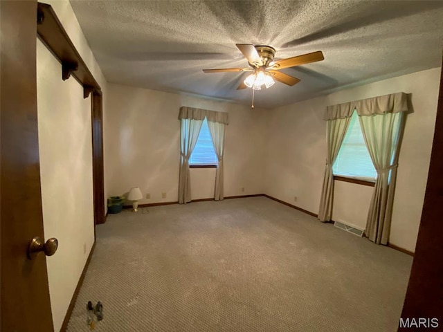 25127 N 16th Ave, Nokomis, IL 62075 - unfurnished room featuring ceiling fan, light colored carpet, a textured ceiling, and baseboards